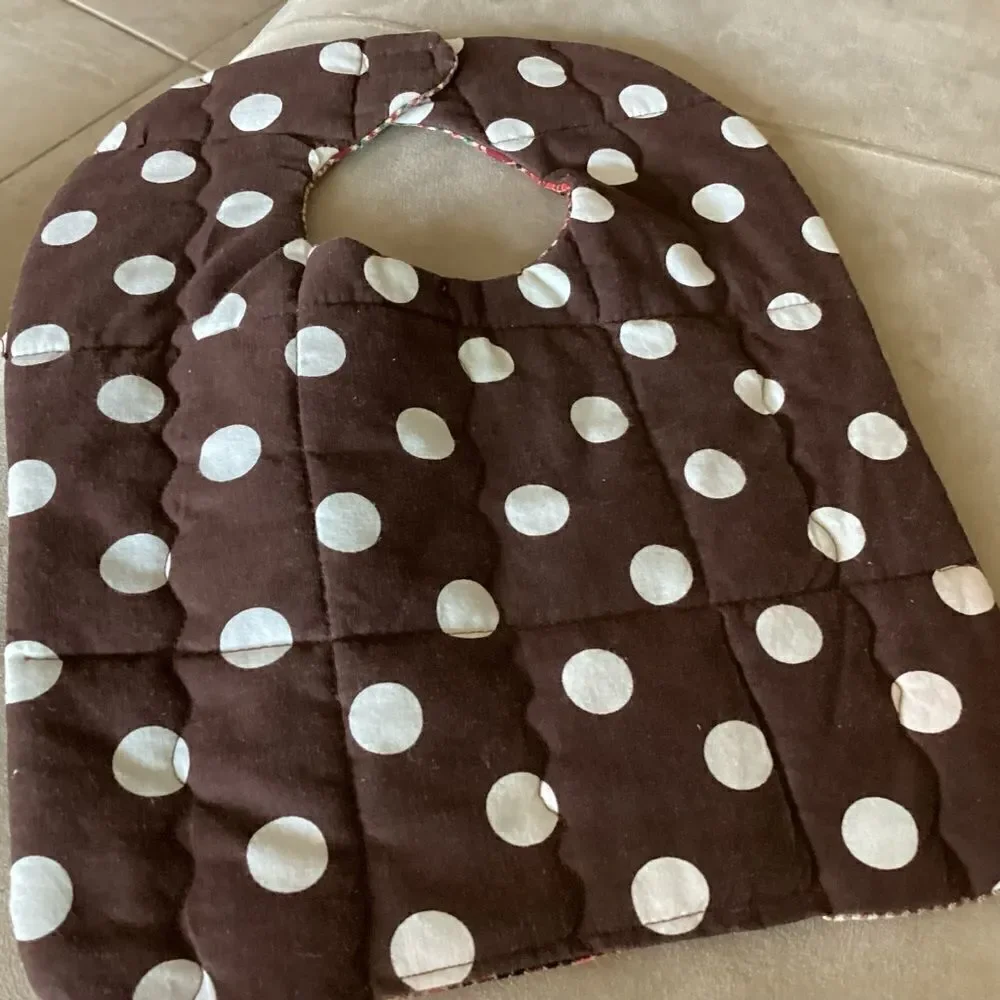 NWT. Handcrafted reversible, baby bib in brown and green shirting materials.